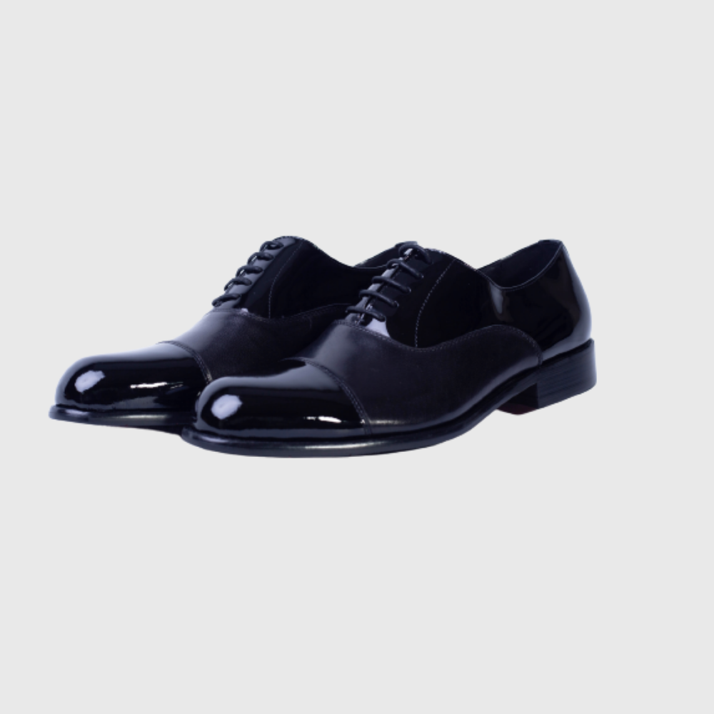 Pair of stylish black men's formal dress shoes with polished leather finish on a white background.